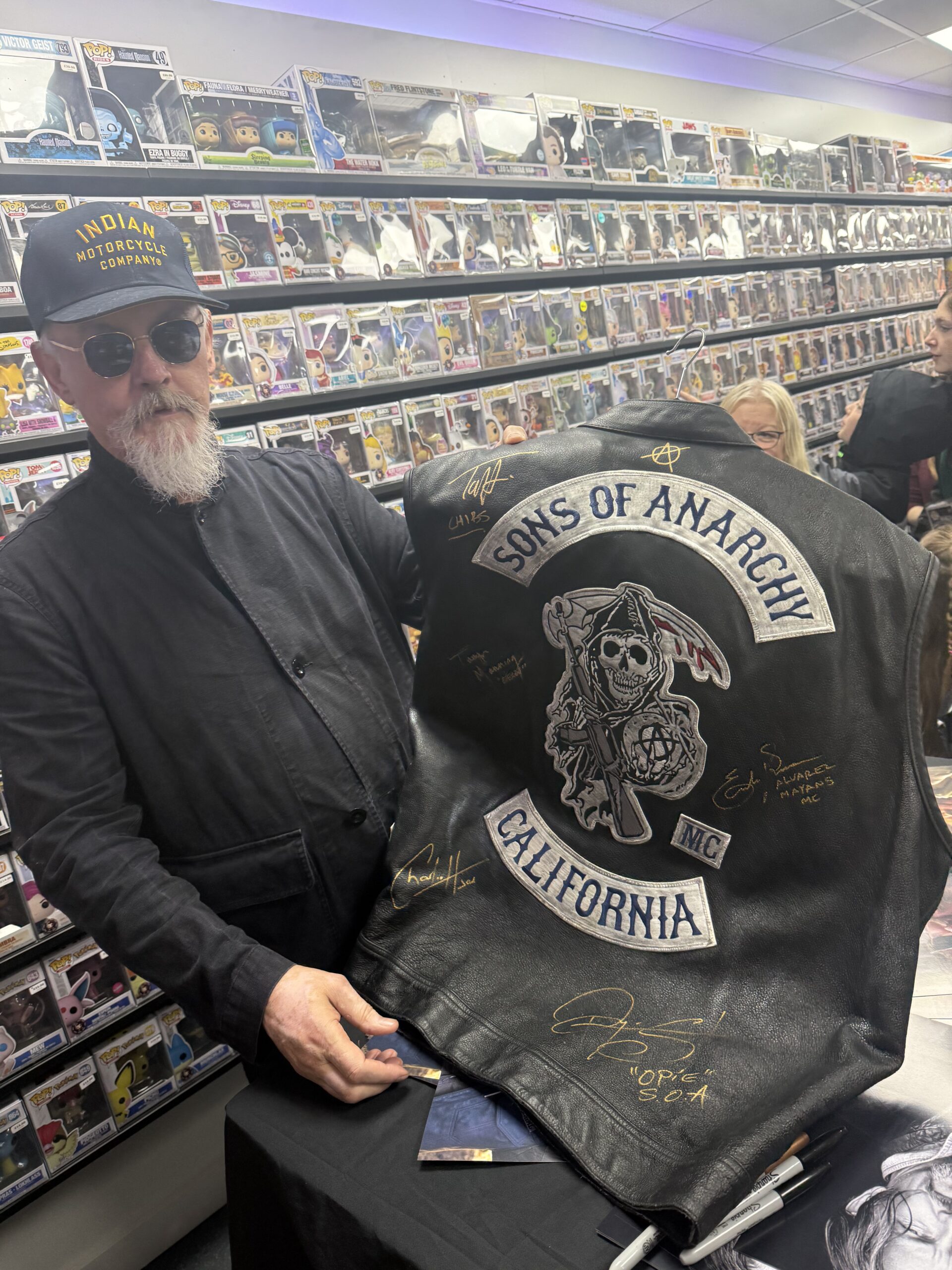 Tommy Flanagan holding signed merchandise at a private appearance